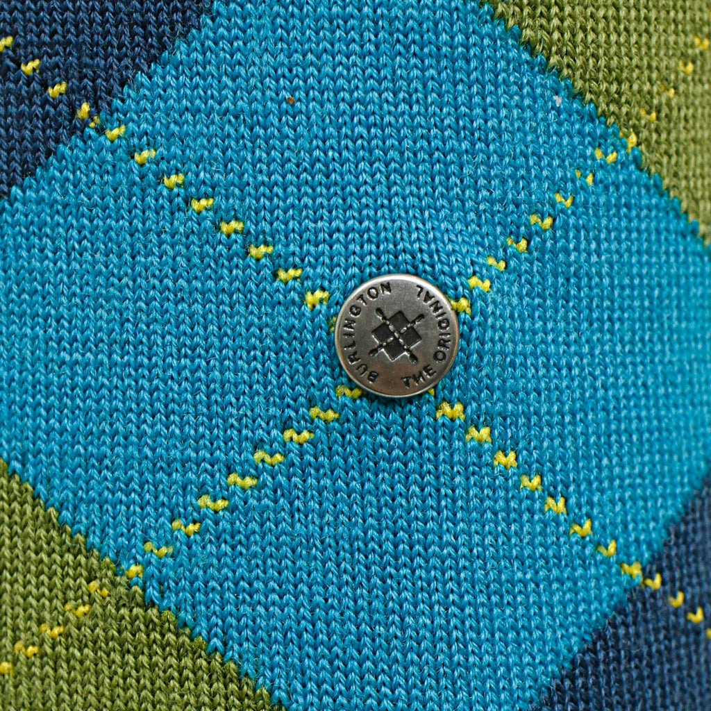 Close-up of the argyle sock with a branded metal button featuring the text 'Burlington'.