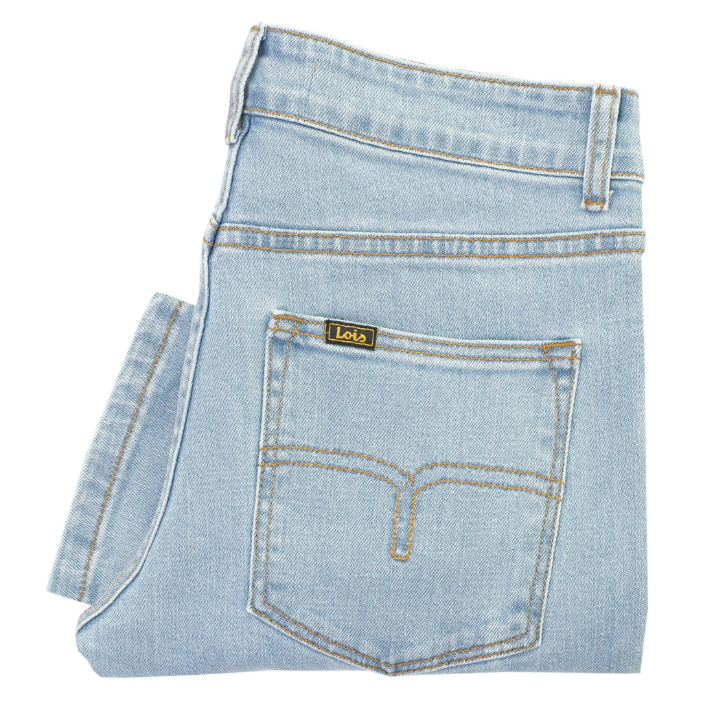 Folded light blue denim jeans with a close-up on the rear pocket and brand patch.