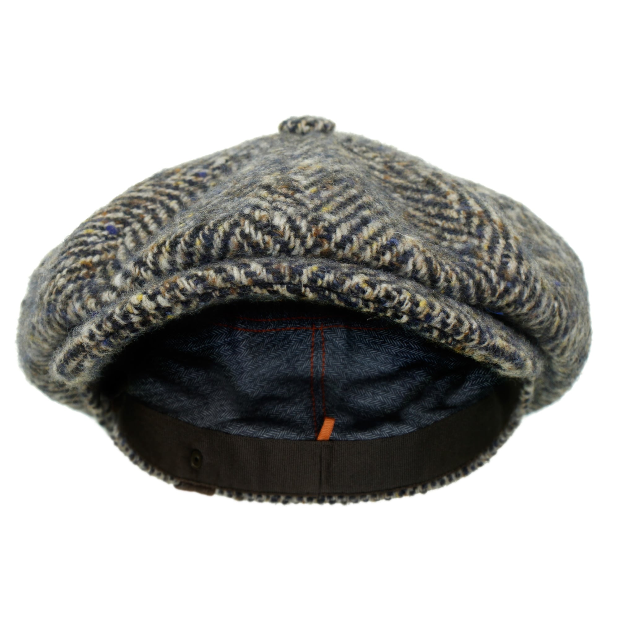 A grey and brown herringbone tweed flat cap, viewed from the front, showing its cosy interior.