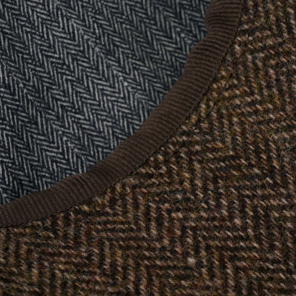Close-up of the contrasting blue and brown herringbone patterns of the cap.