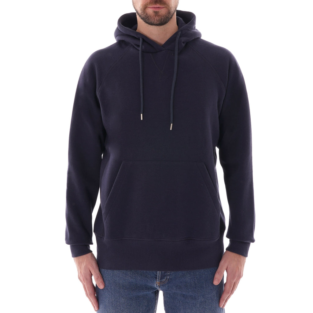 A man models a C17 Jeans raglan sleeve hoodie in navy.
