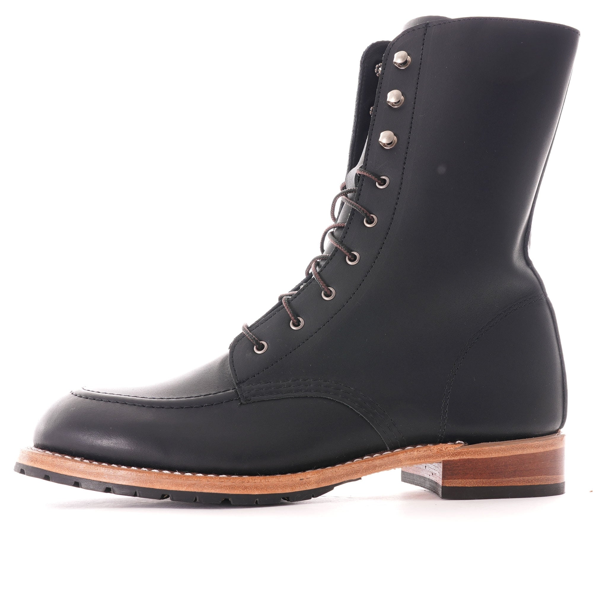 A black leather boot with laces and a light brown sole, viewed from the side.