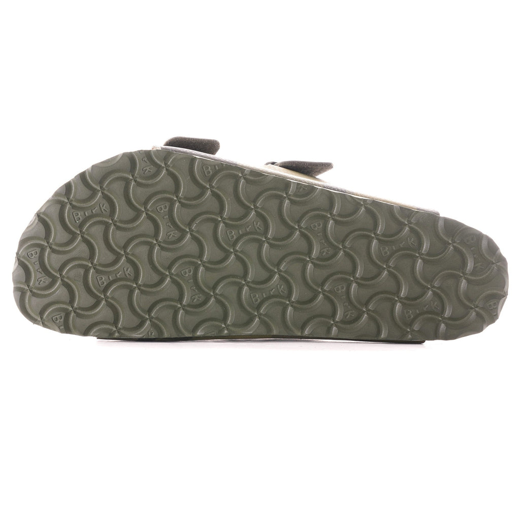Underside view of a green camouflage Arizona Birkenstock sandal, showing the sole pattern.