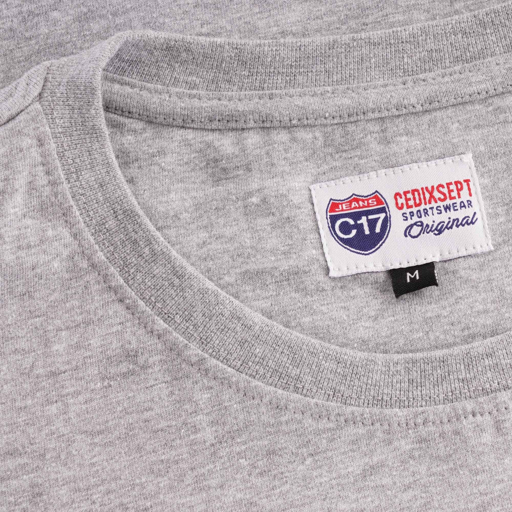 The collar area of a grey T-shirt with a branded 'C17 CEDIXSEPT' label.
