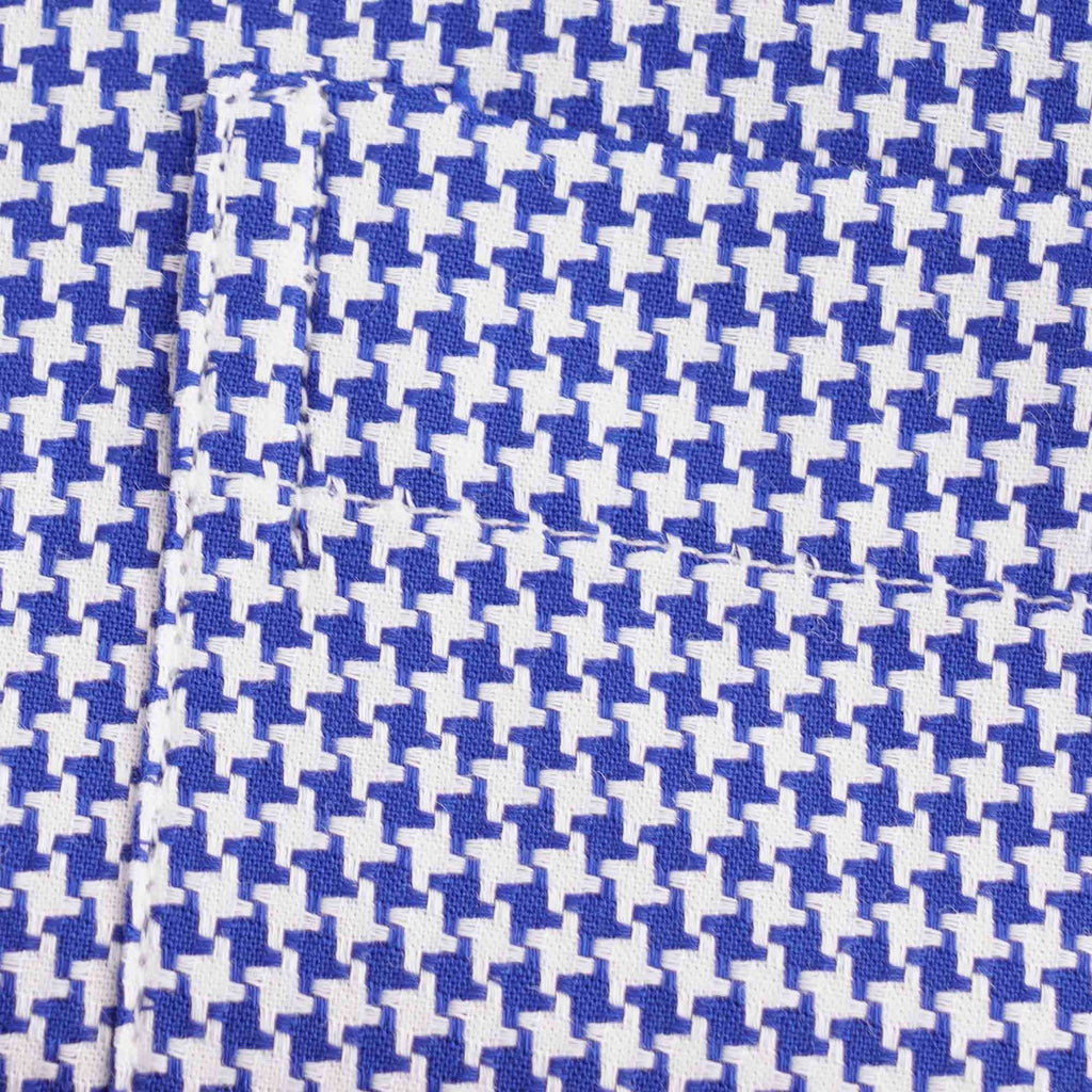 Close-up of the blue and white houndstooth pattern of the shirt's fabric.