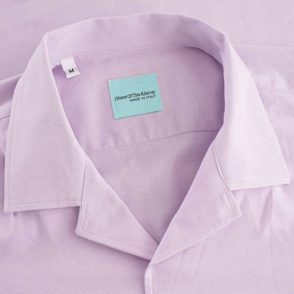 A close-up shot of the shirt's collar and brand label.