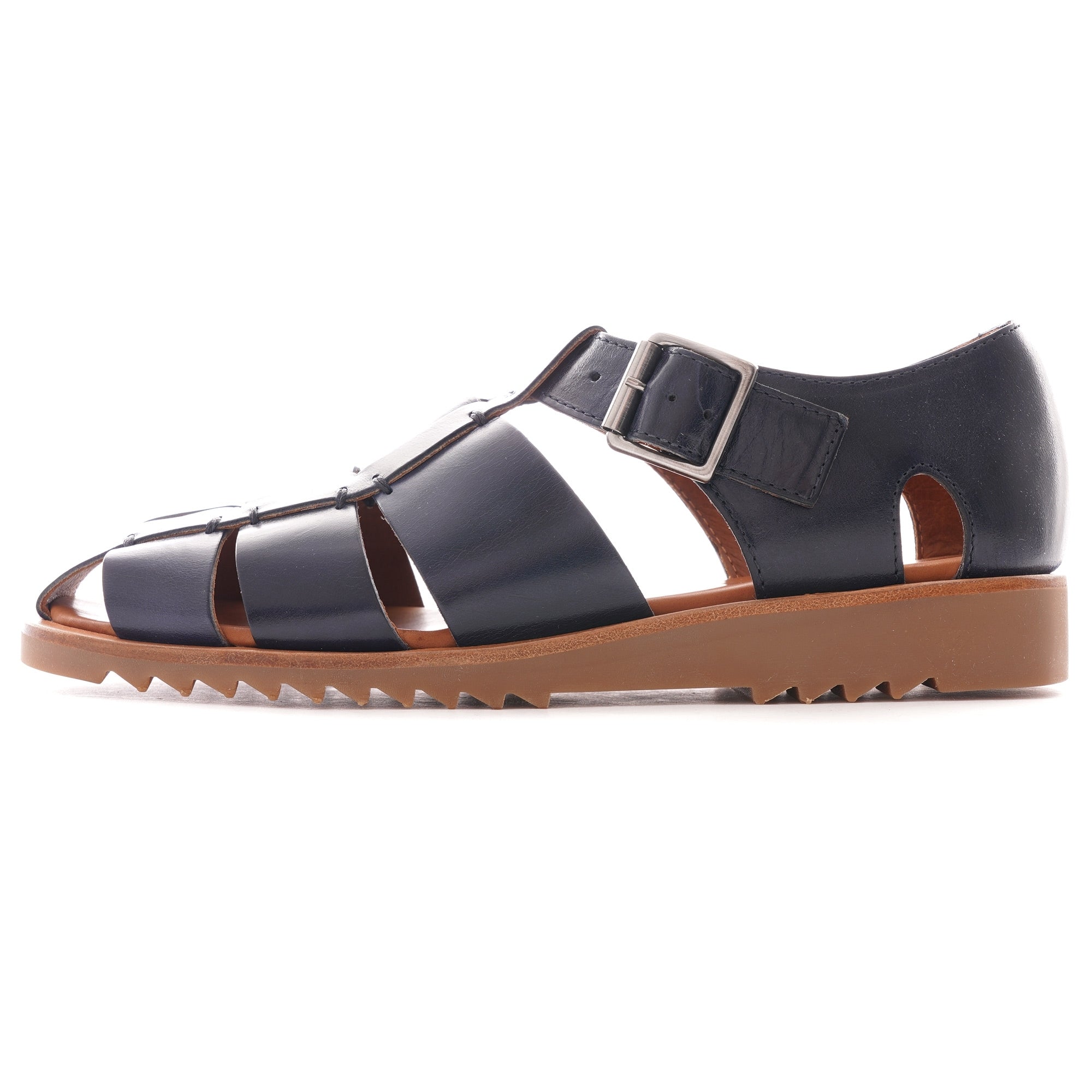 A single dark blue leather fisherman's sandal with a brown sole, viewed from the side.