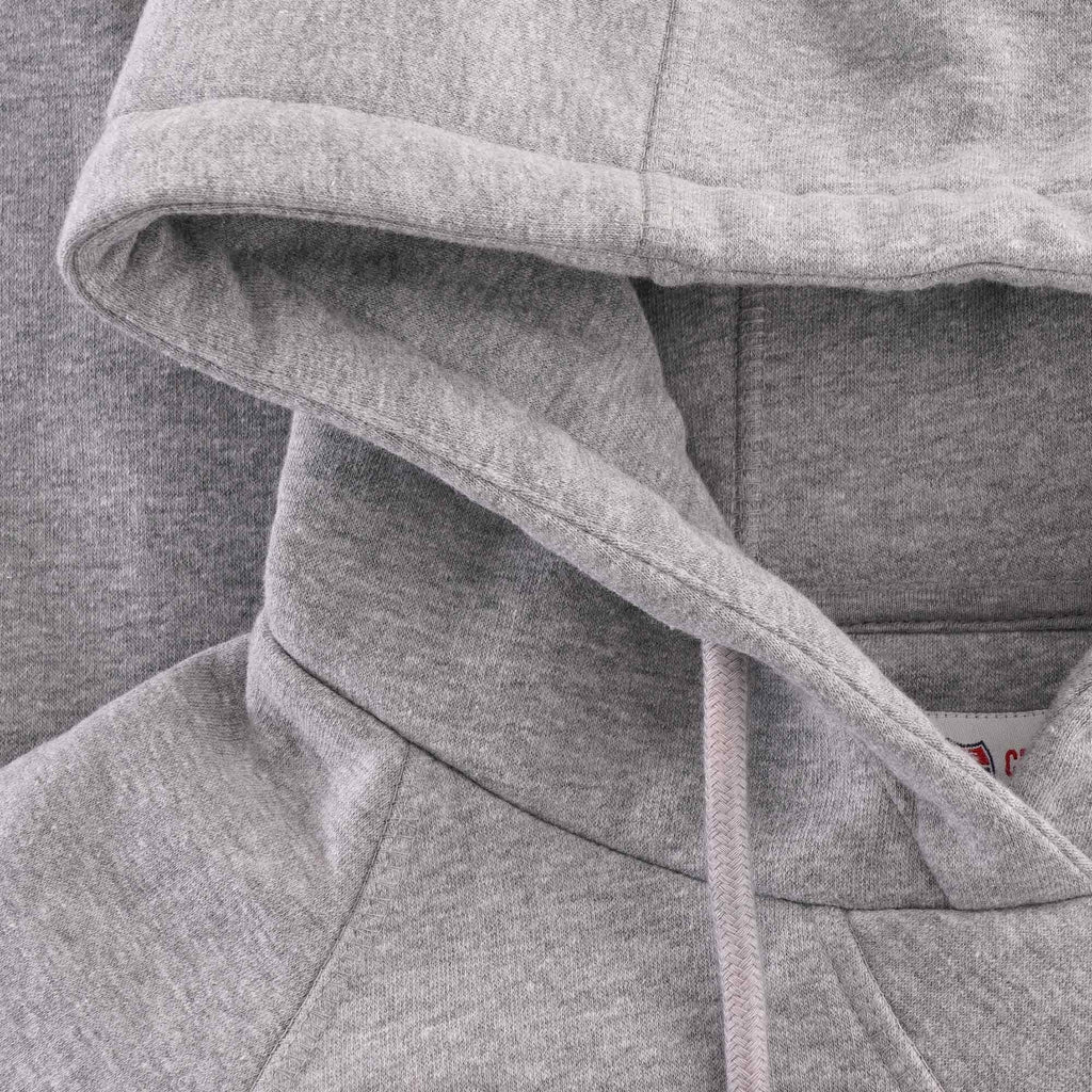 A close-up of the grey hoodie's hood and drawstring detail.