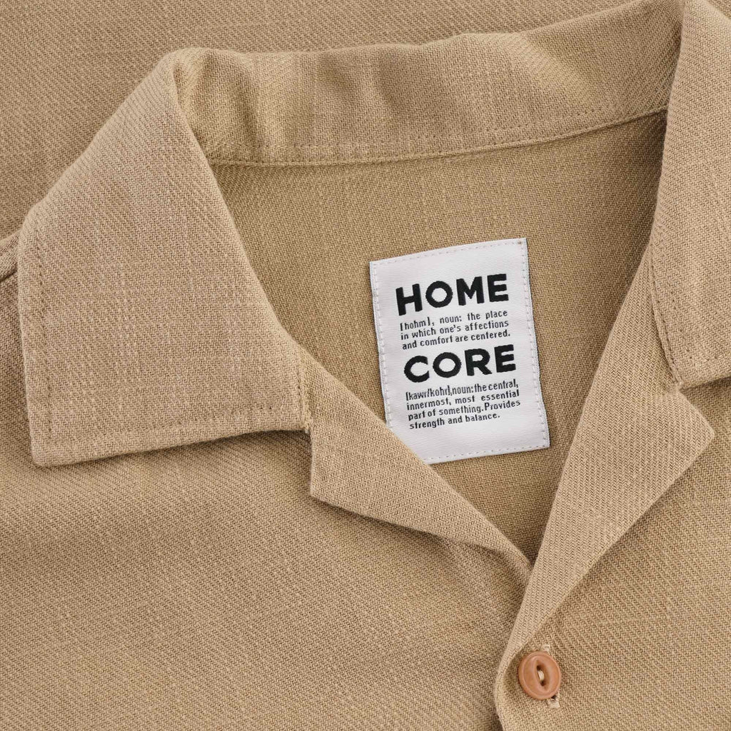 Close-up of the shirt's collar and brand label, 'HOME CORE'.