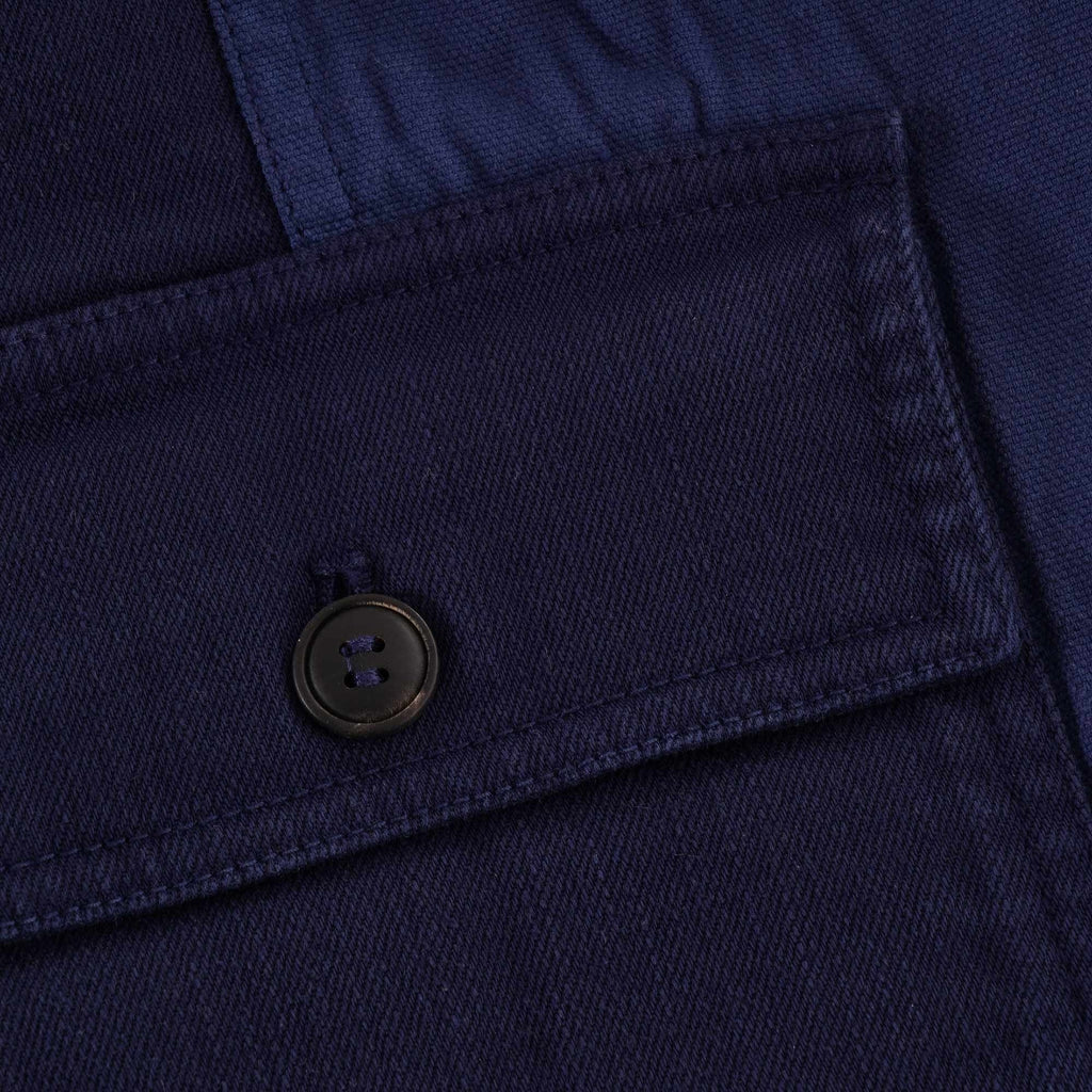Close-up of the right chest pocket with a button closure.