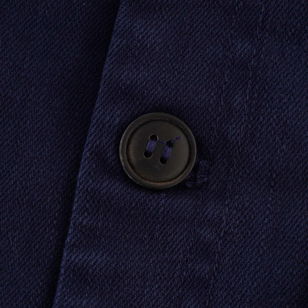 Close-up of the button on the left side of the vest.