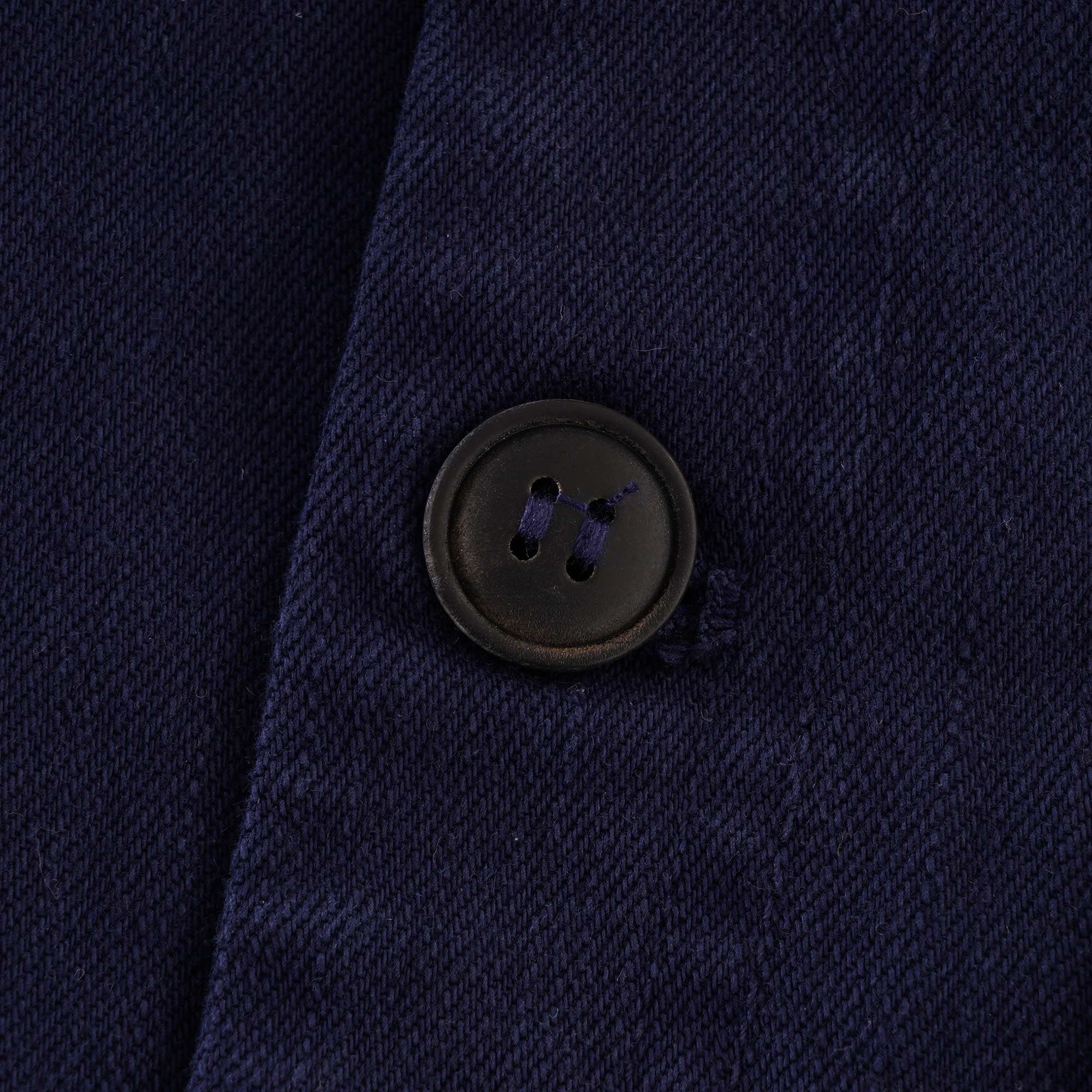 Close-up of the button on the left side of the vest.