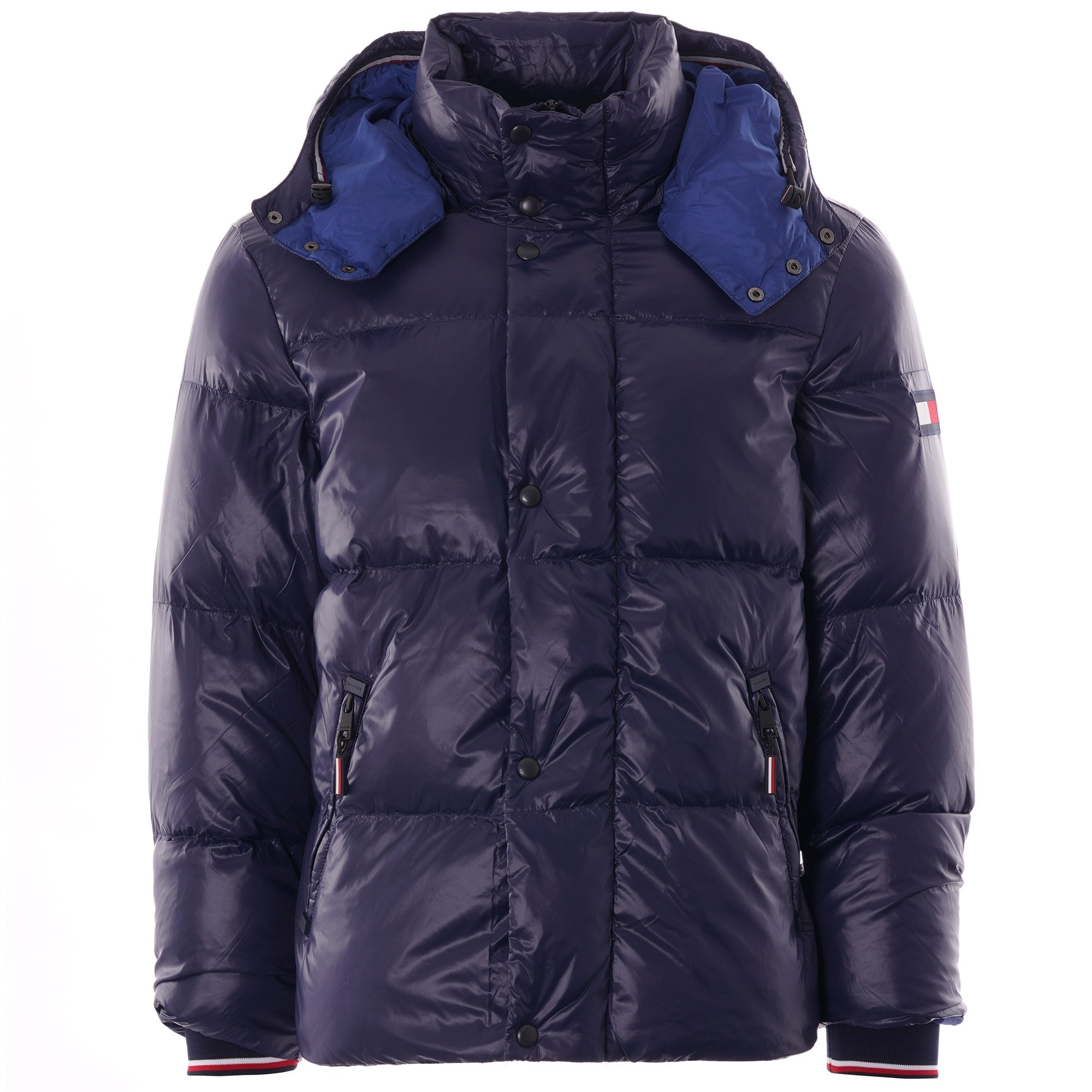 A navy blue puffer jacket with a hood, blue lining, and a small flag logo on the arm.