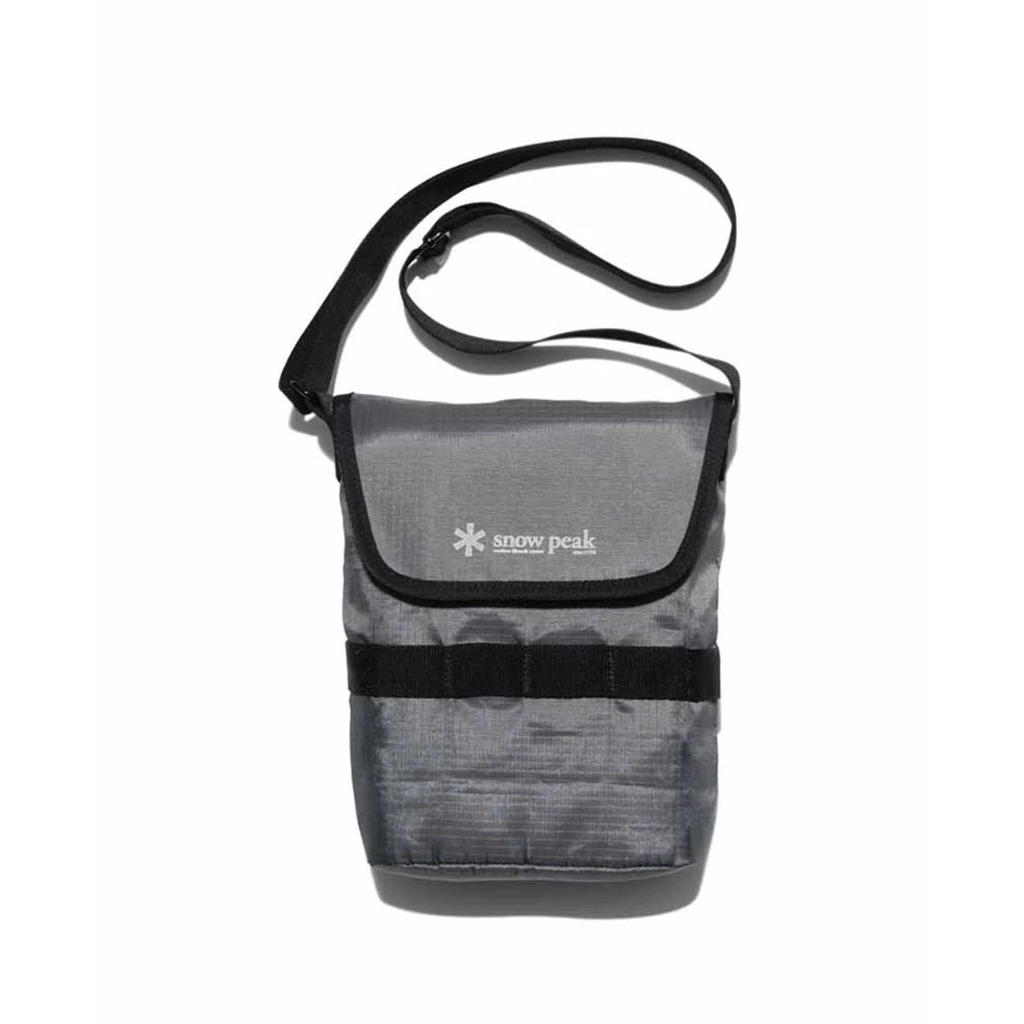 A grey shoulder bag with a black strap and the Snow Peak logo.