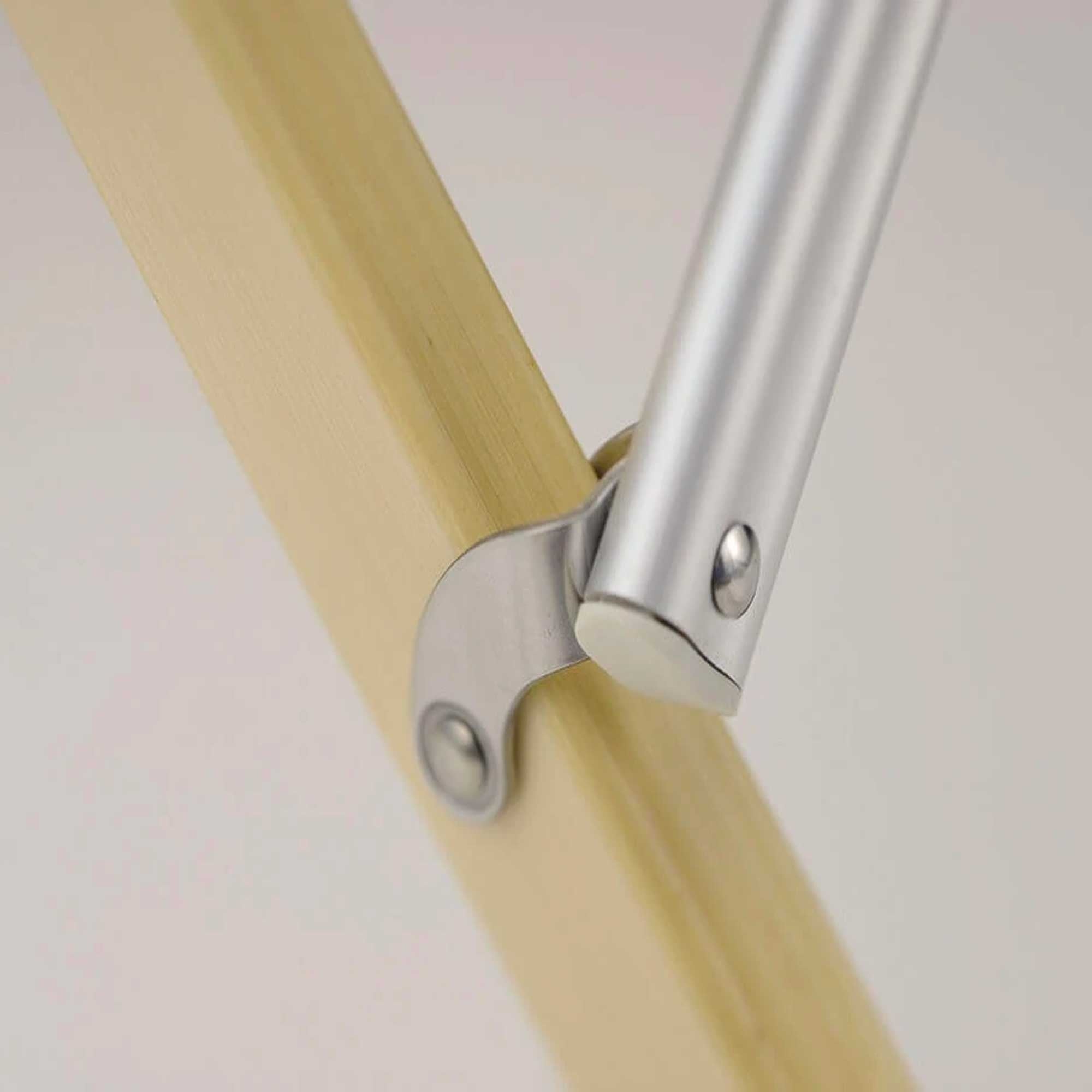 A close-up of the chair's leg joint, highlighting the durable materials.