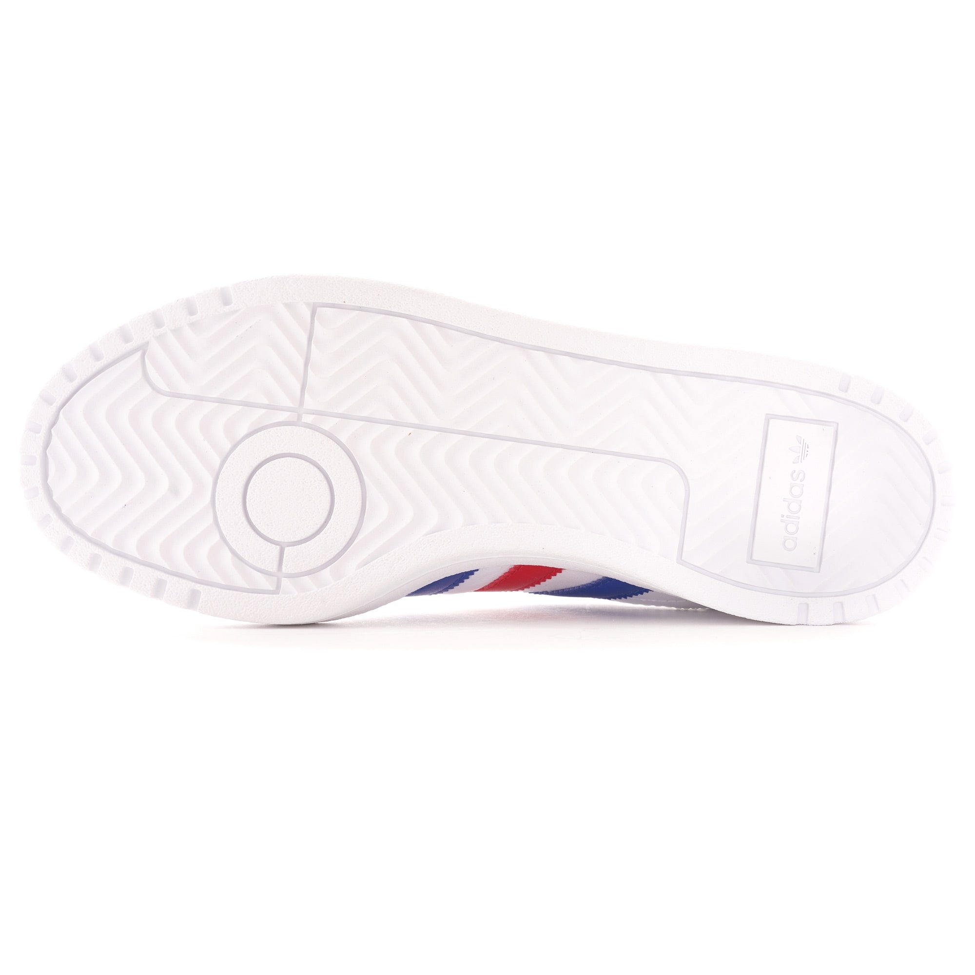 A close-up, low-angle, sole-view of a white Adidas trainer with blue and red stripes.