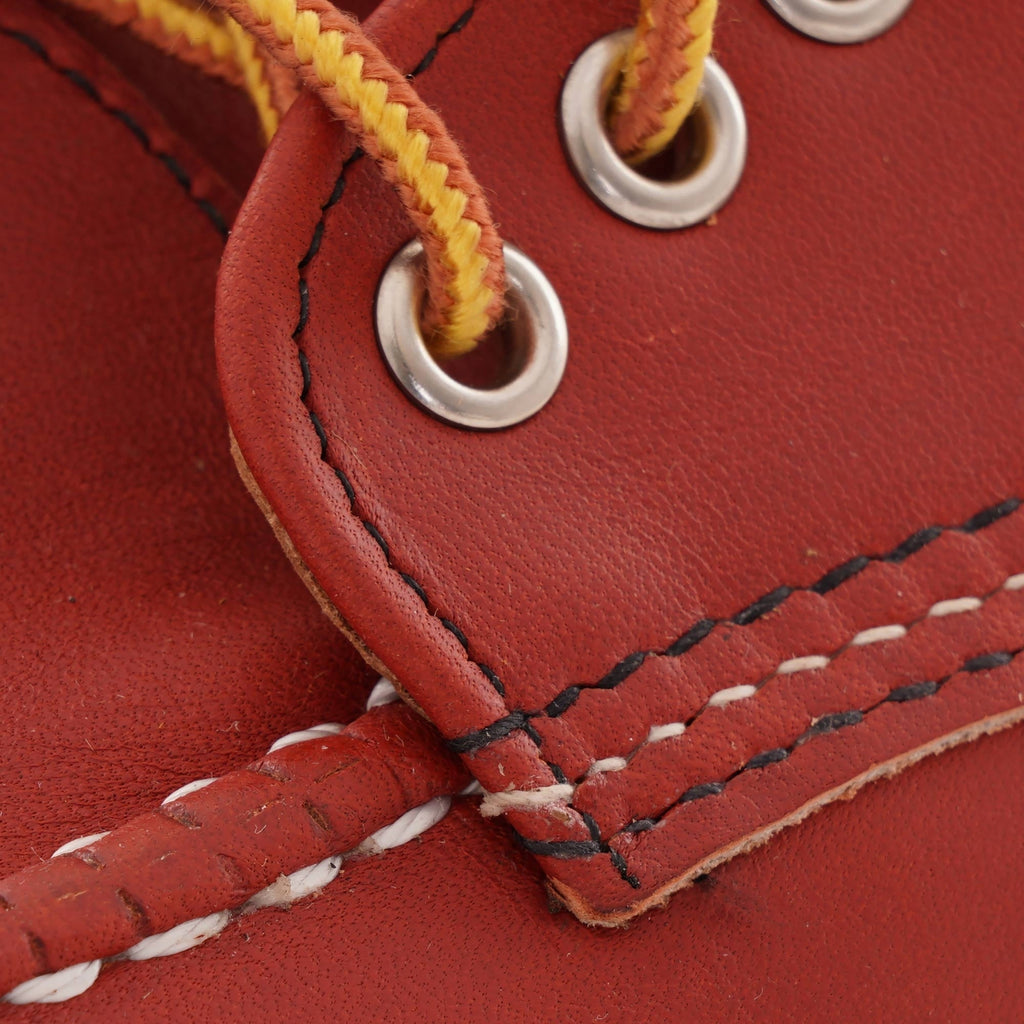 Close-up of the yellow laces and eyelets on a Red Wing Postman Oxford shoe.