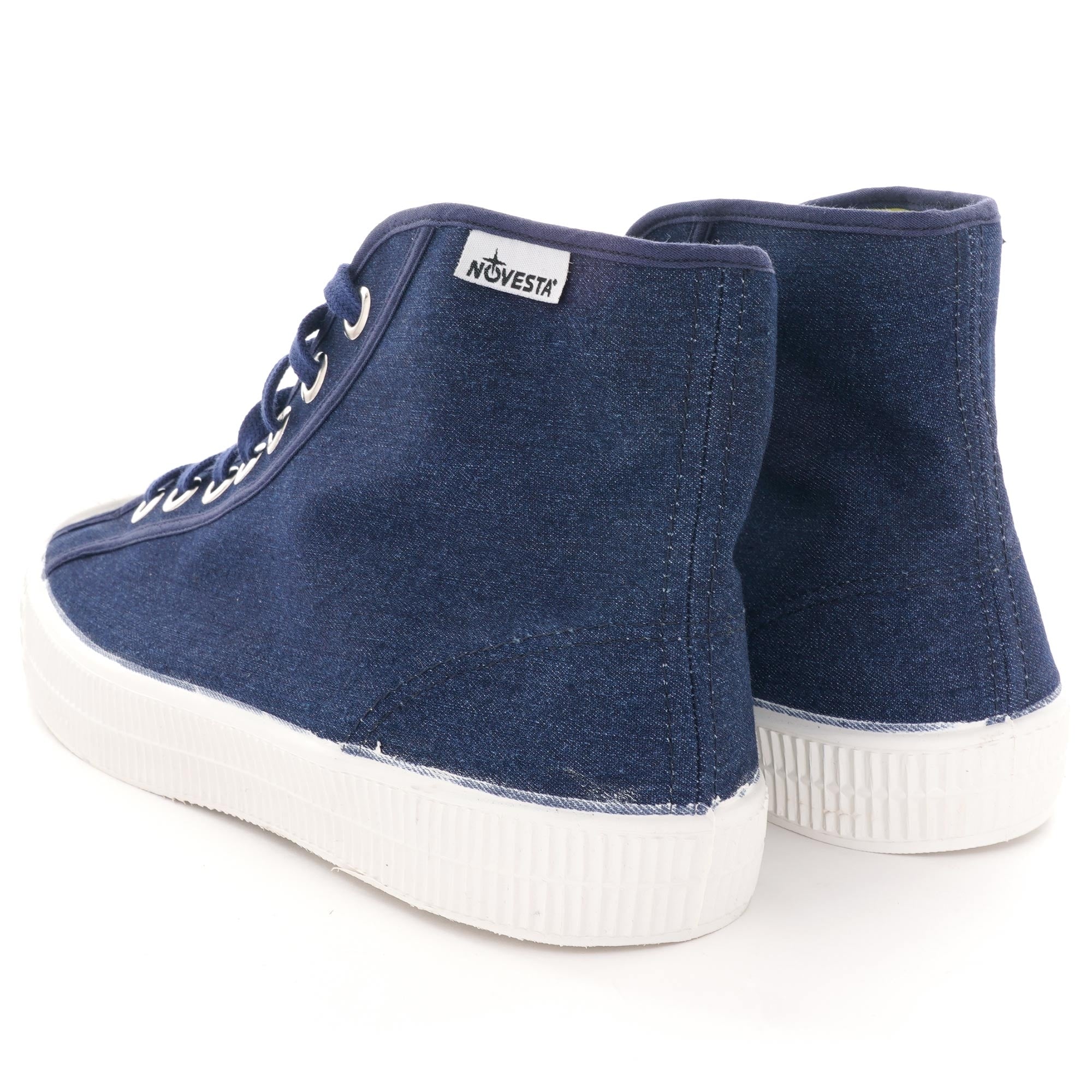 A pair of Novesta Star Master hi-top sneakers in navy, shown from the back.
