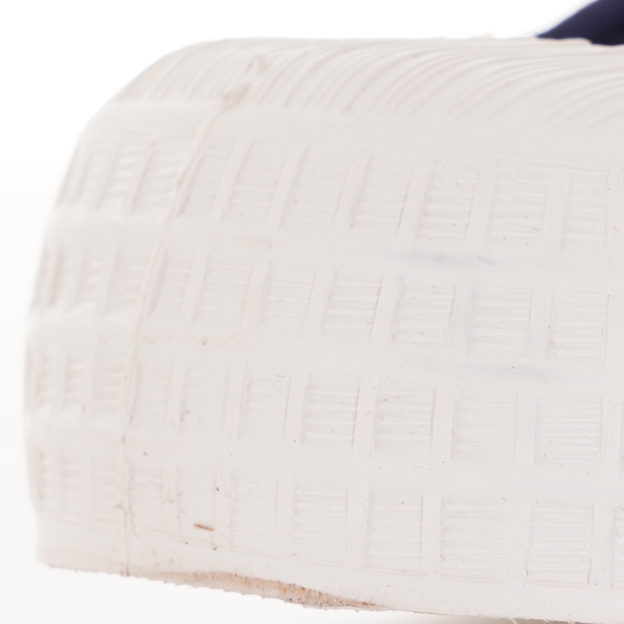 A close-up of the rubber foxing and part of the sole of a Novesta sneaker.