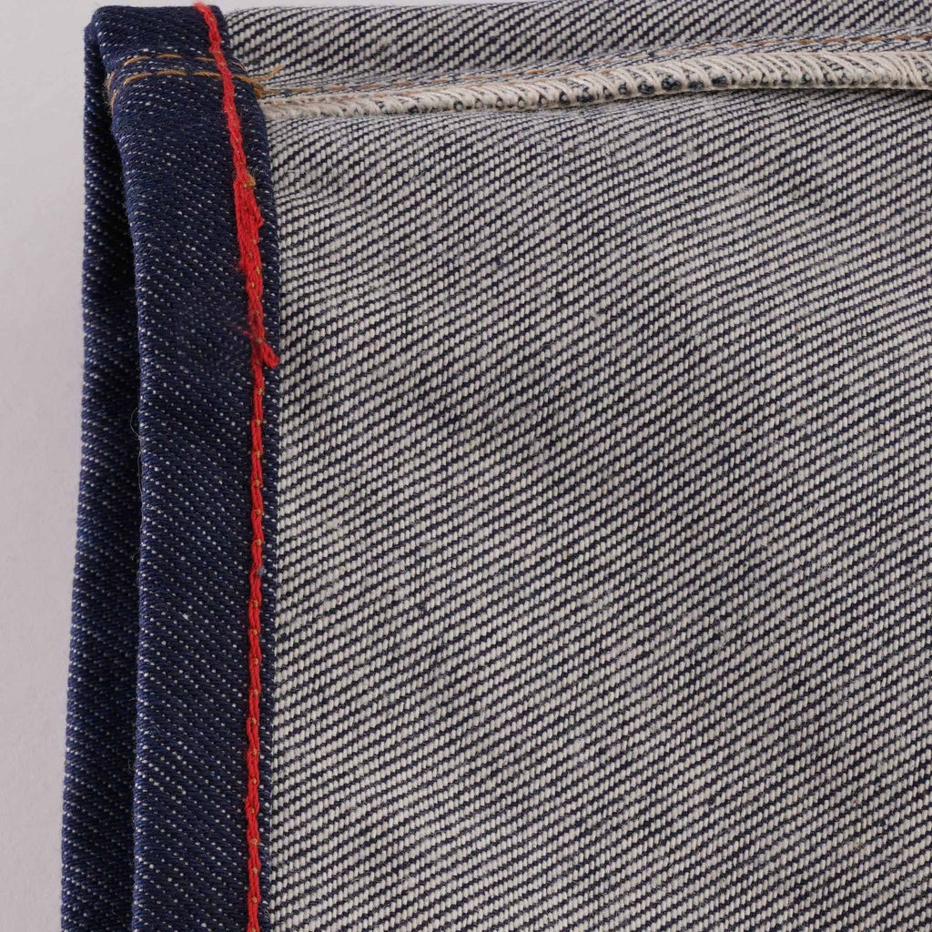 Detail of the selvedge denim edge with red stitching on C17 jeans.