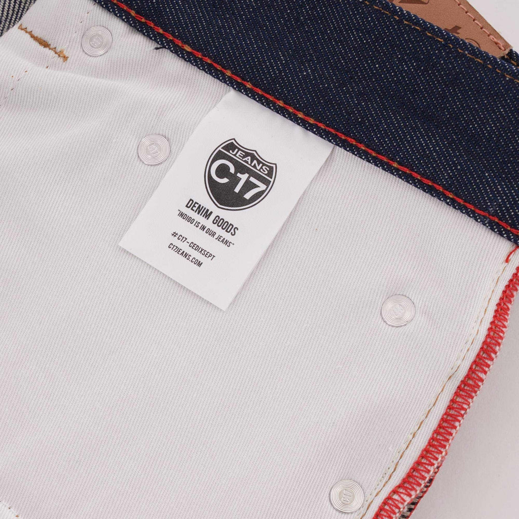 Inside view of C17 jeans showing a branded care label and pocket lining.