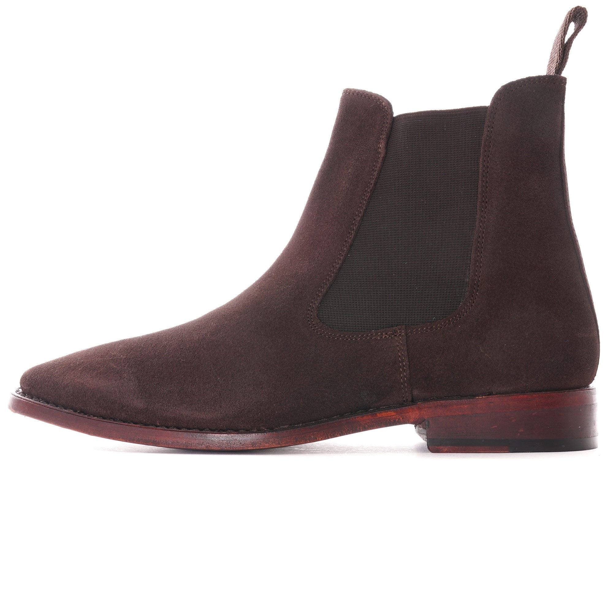 Side profile of a single brown suede Chelsea boot.