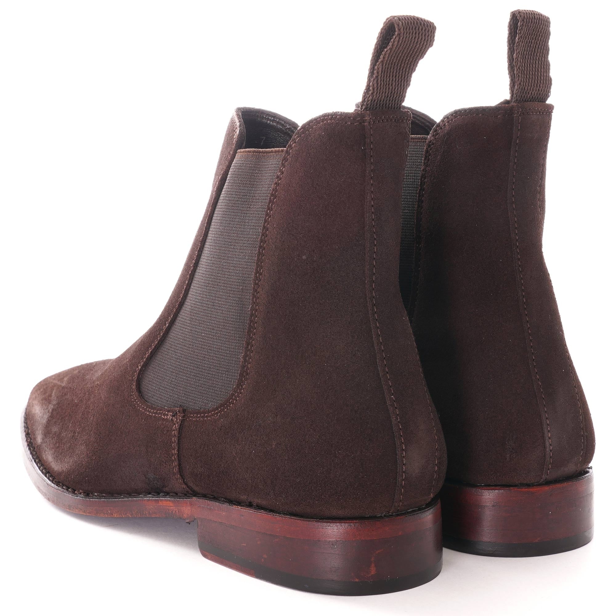 Rear view of a pair of brown suede Chelsea boots.