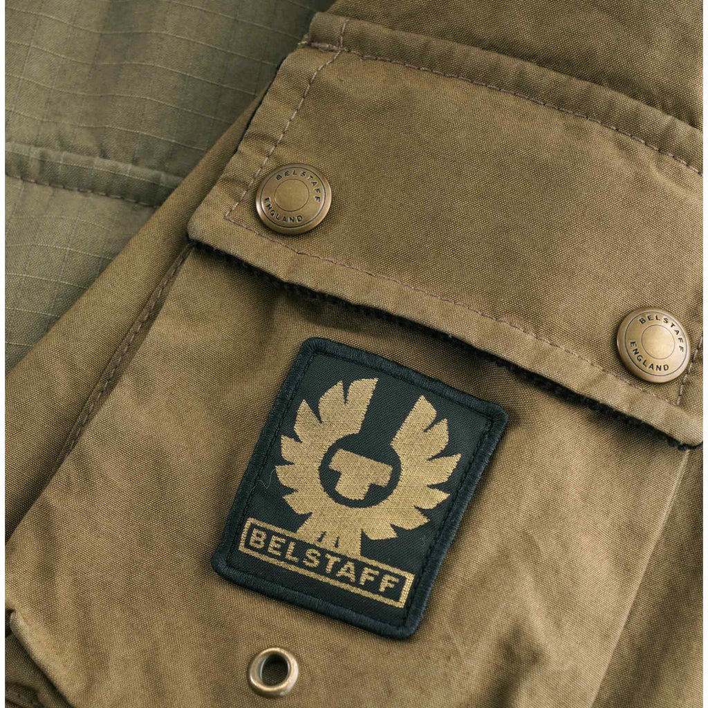 Close-up of the iconic Belstaff Phoenix logo patch on a pocket of the Fieldmaster Jacket.