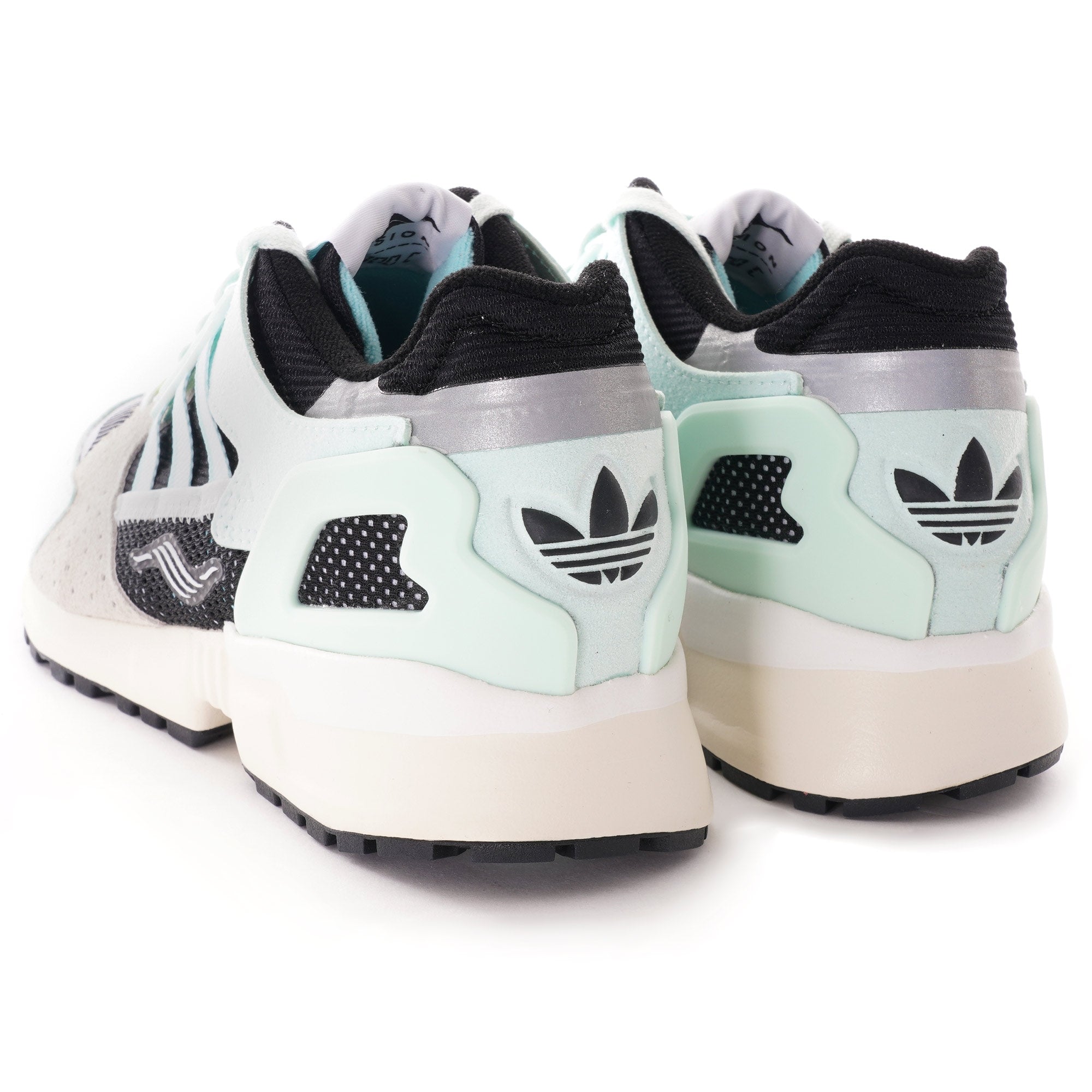 Rear view of a pair of Adidas ZX 8000 Clear Aqua trainers, white background.