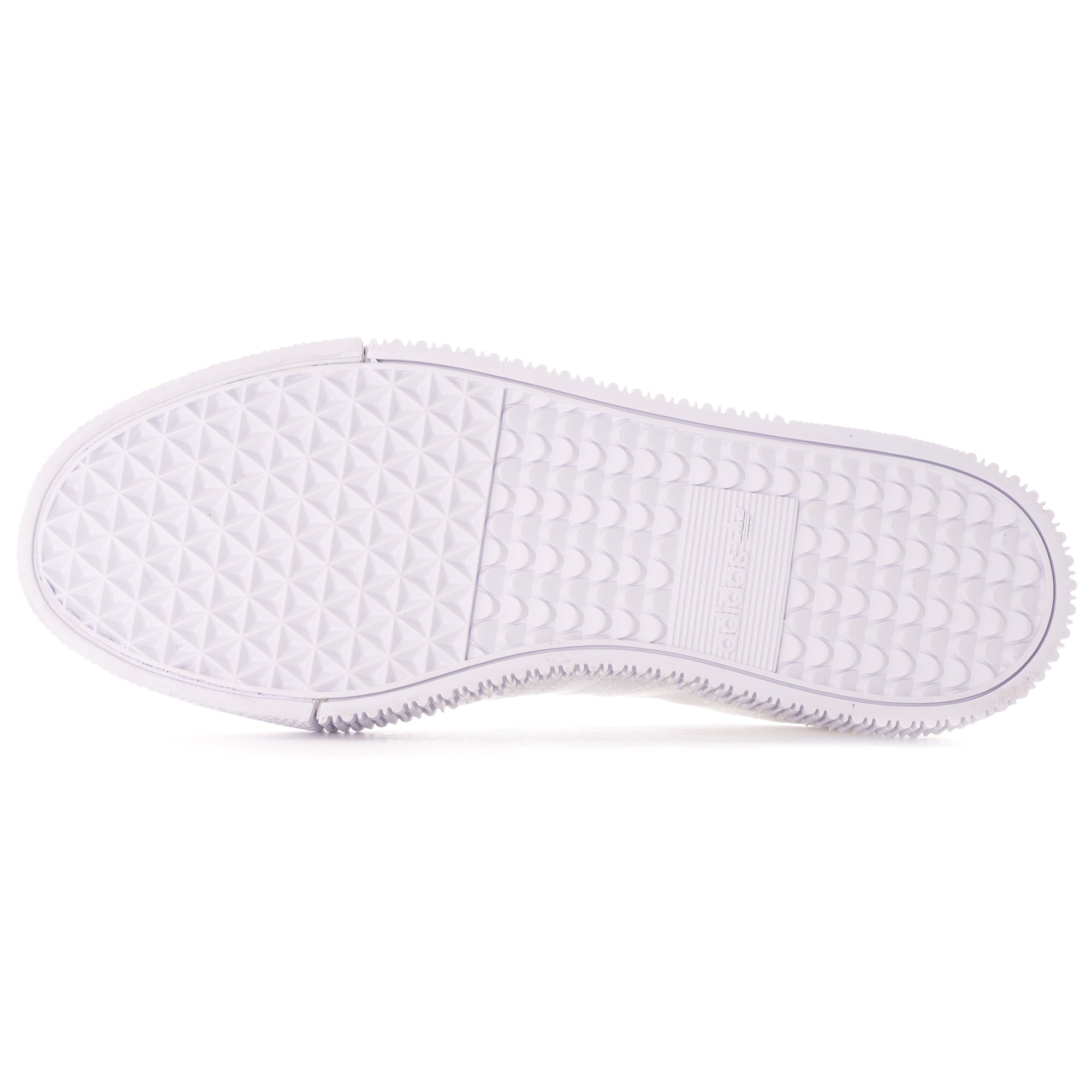 The sole of a white Adidas Sambarose trainer, showing the grip pattern.