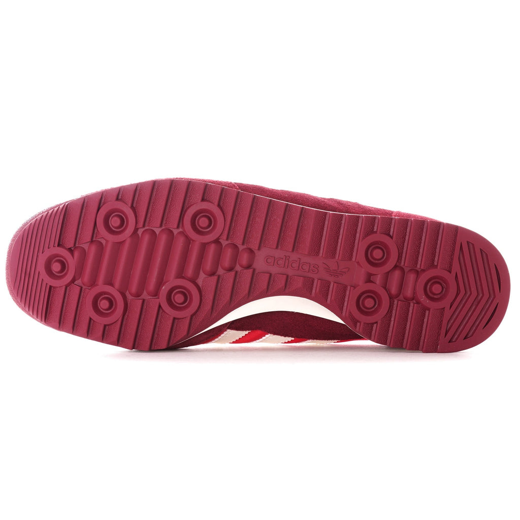 The sole of a red adidas SL 72 RS trainer, showing the circular tread pattern.