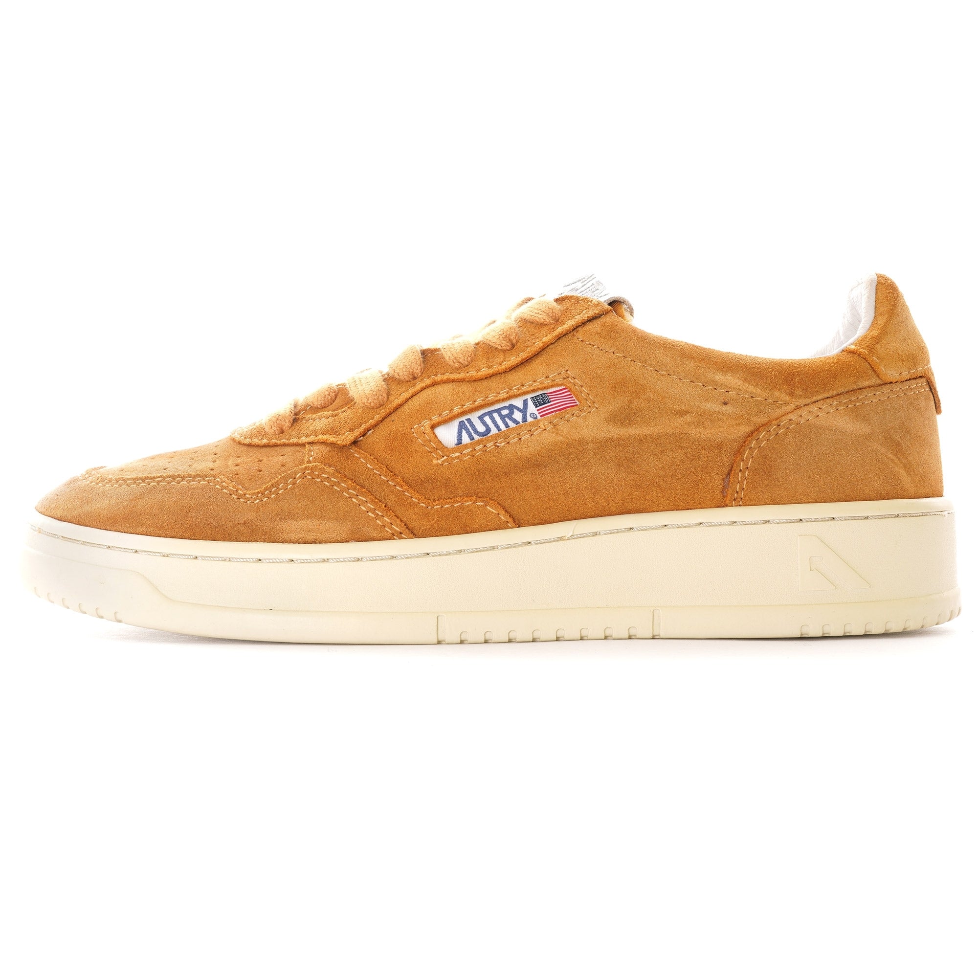 Side profile of an Autry Medalist Low Suede in tan, with a cream sole and white details.