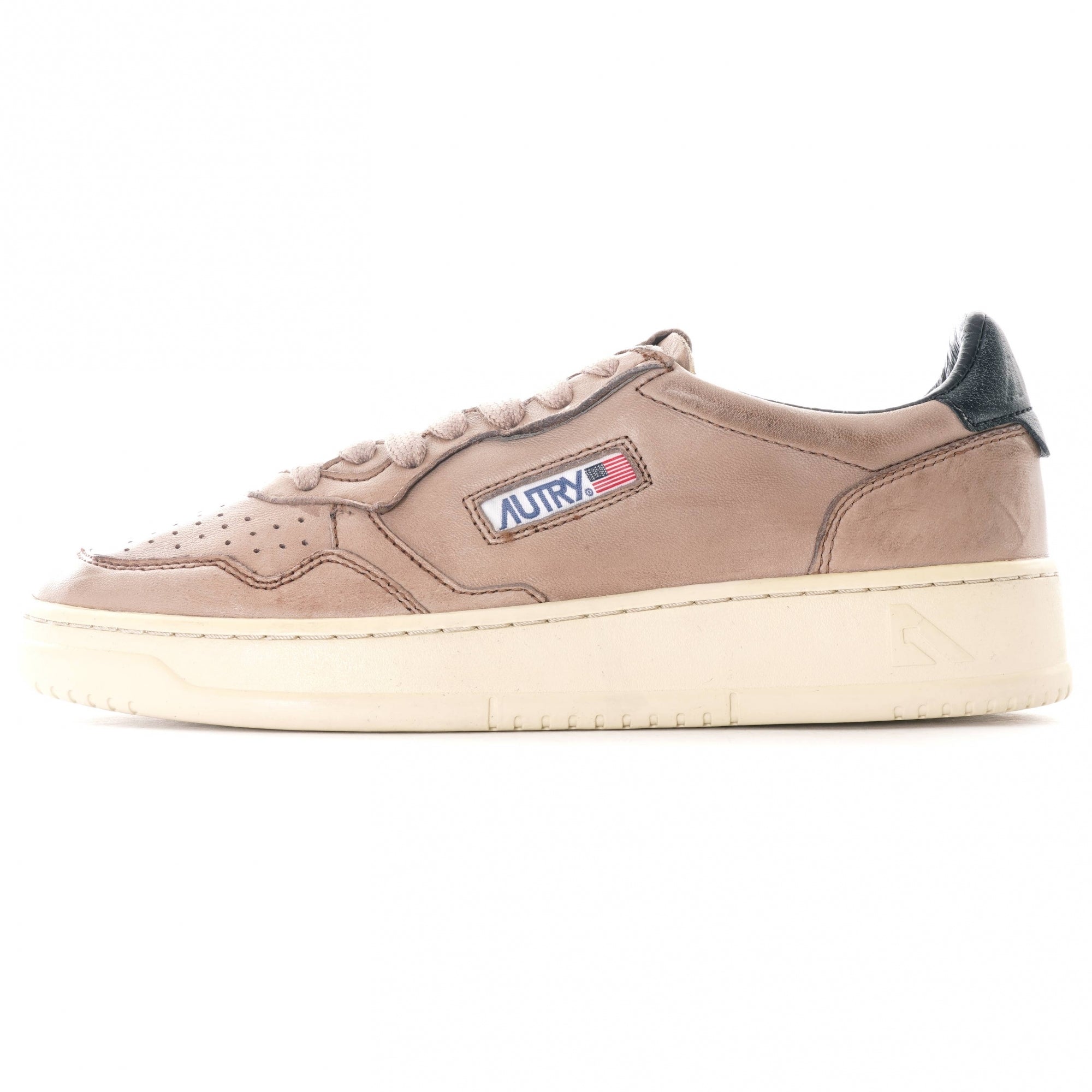 Side profile of an Autry Medalist Low sneaker in grey-brown leather with a black heel tab.