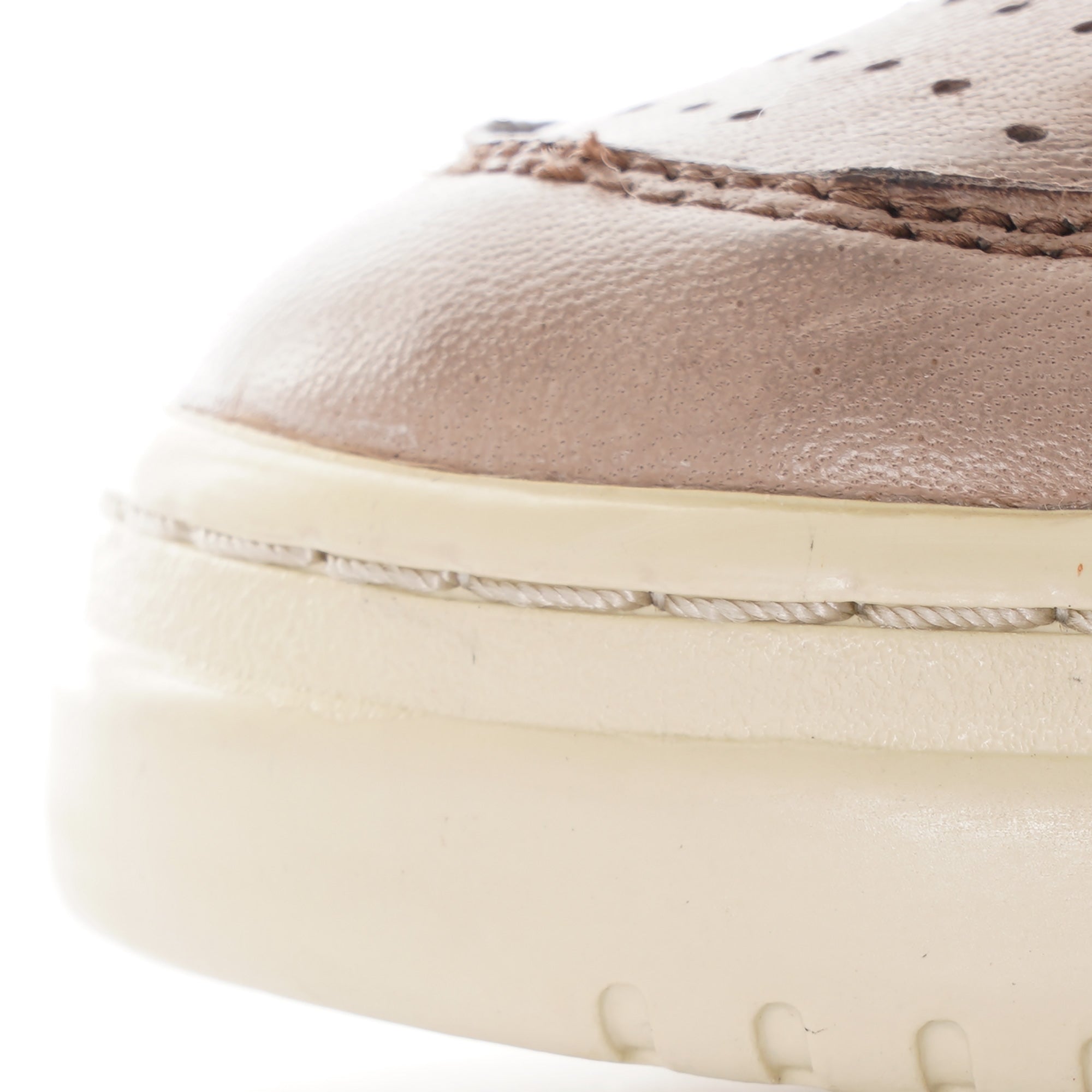 Close-up of the front toe area of an Autry Medalist Low sneaker, highlighting perforations.
