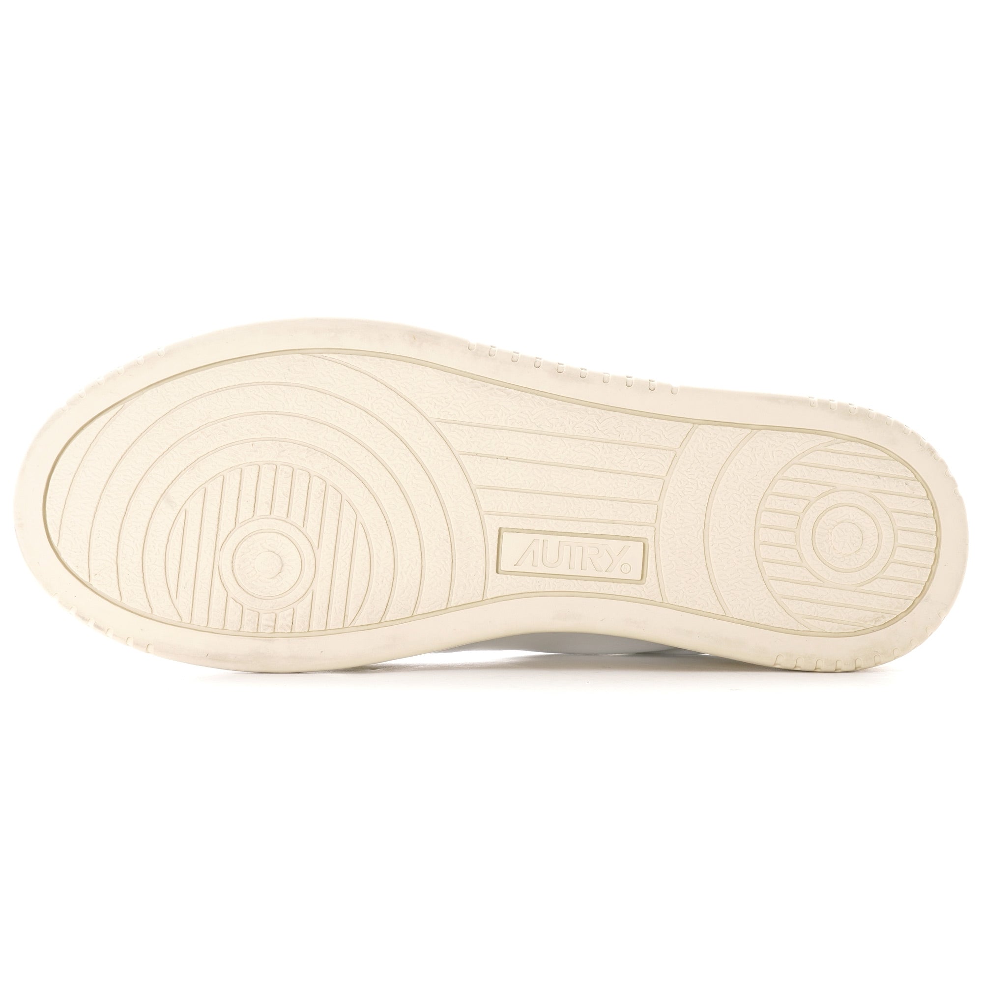 The sole of a white Autry Medalist trainer with textured grip and branding.