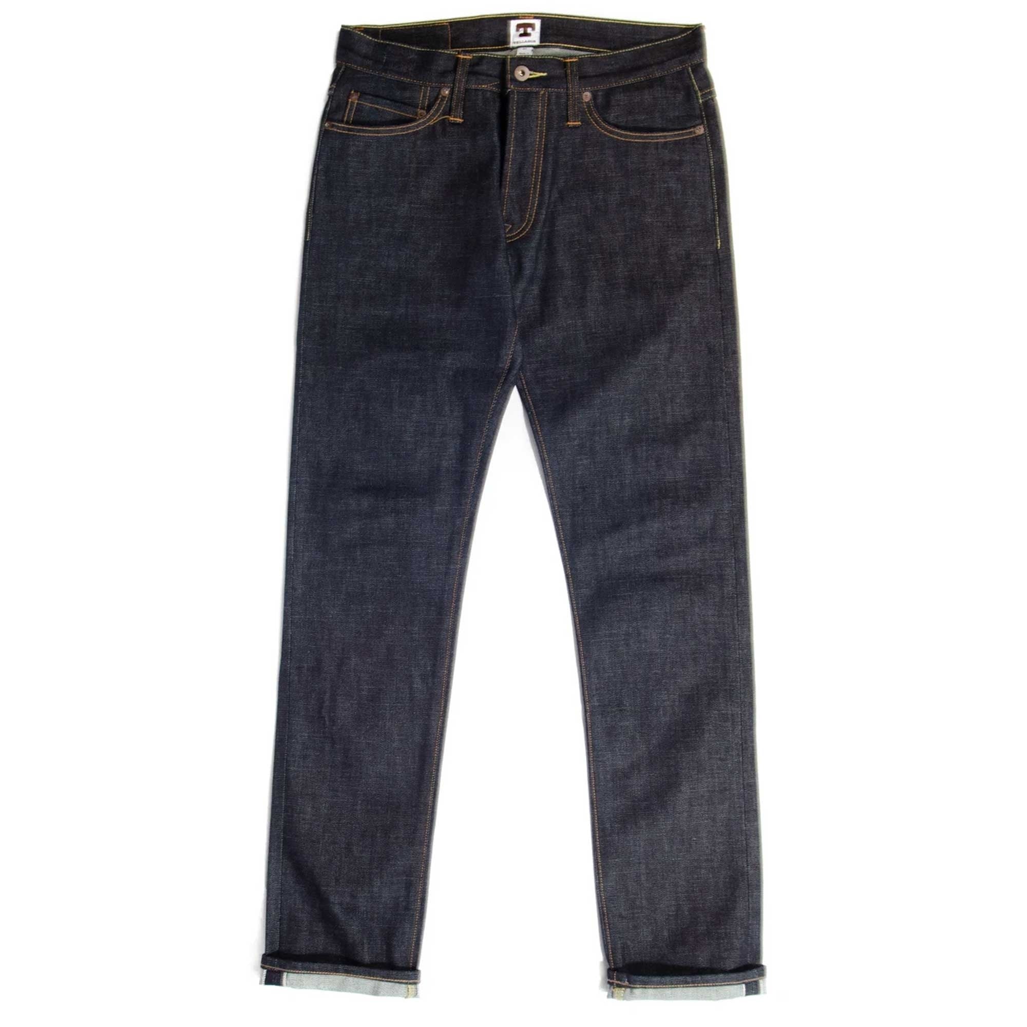 Dark blue denim jeans with a slight taper and cuffed hems on a white background.