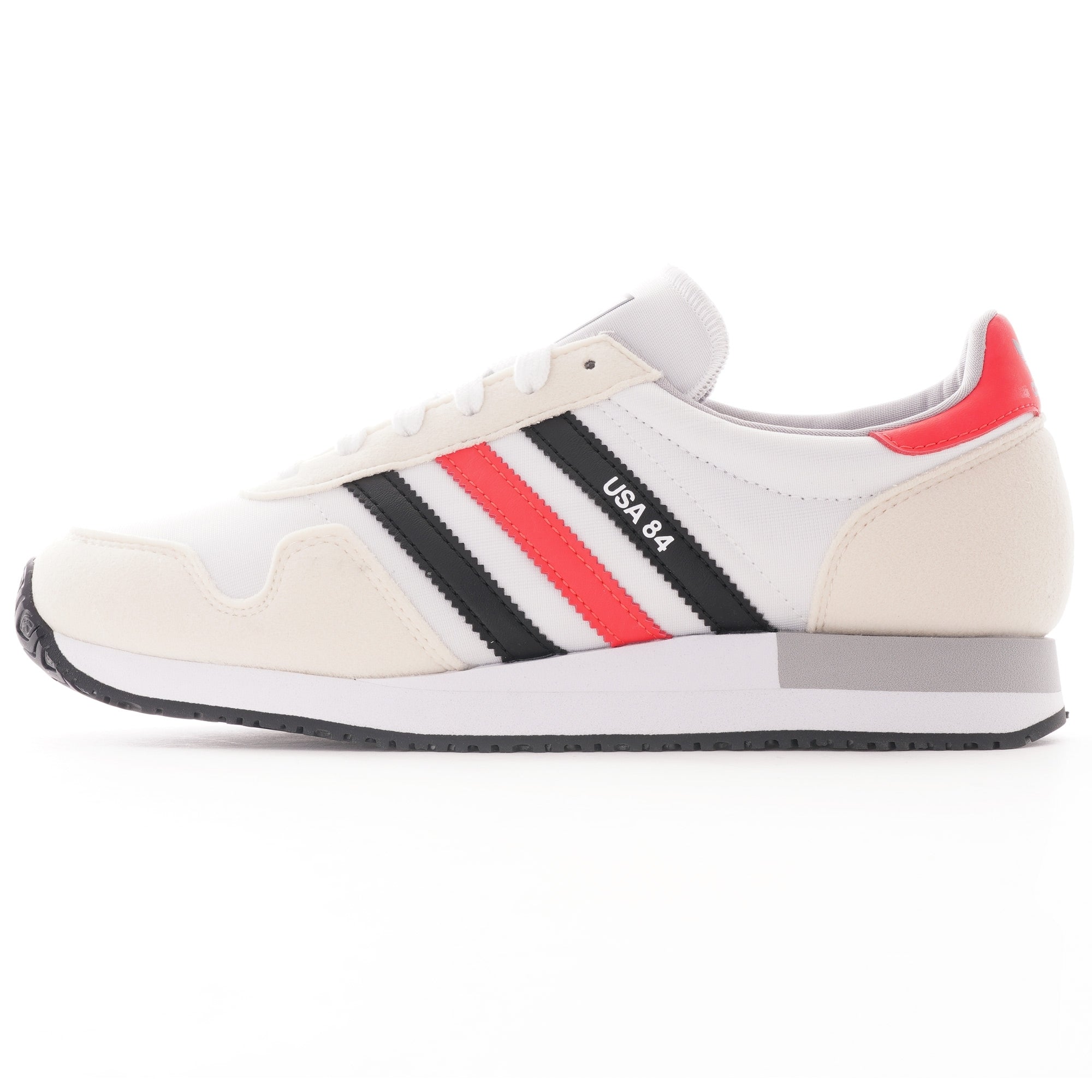 A white, red, and black Adidas USA 84 trainer is shown from the side.
