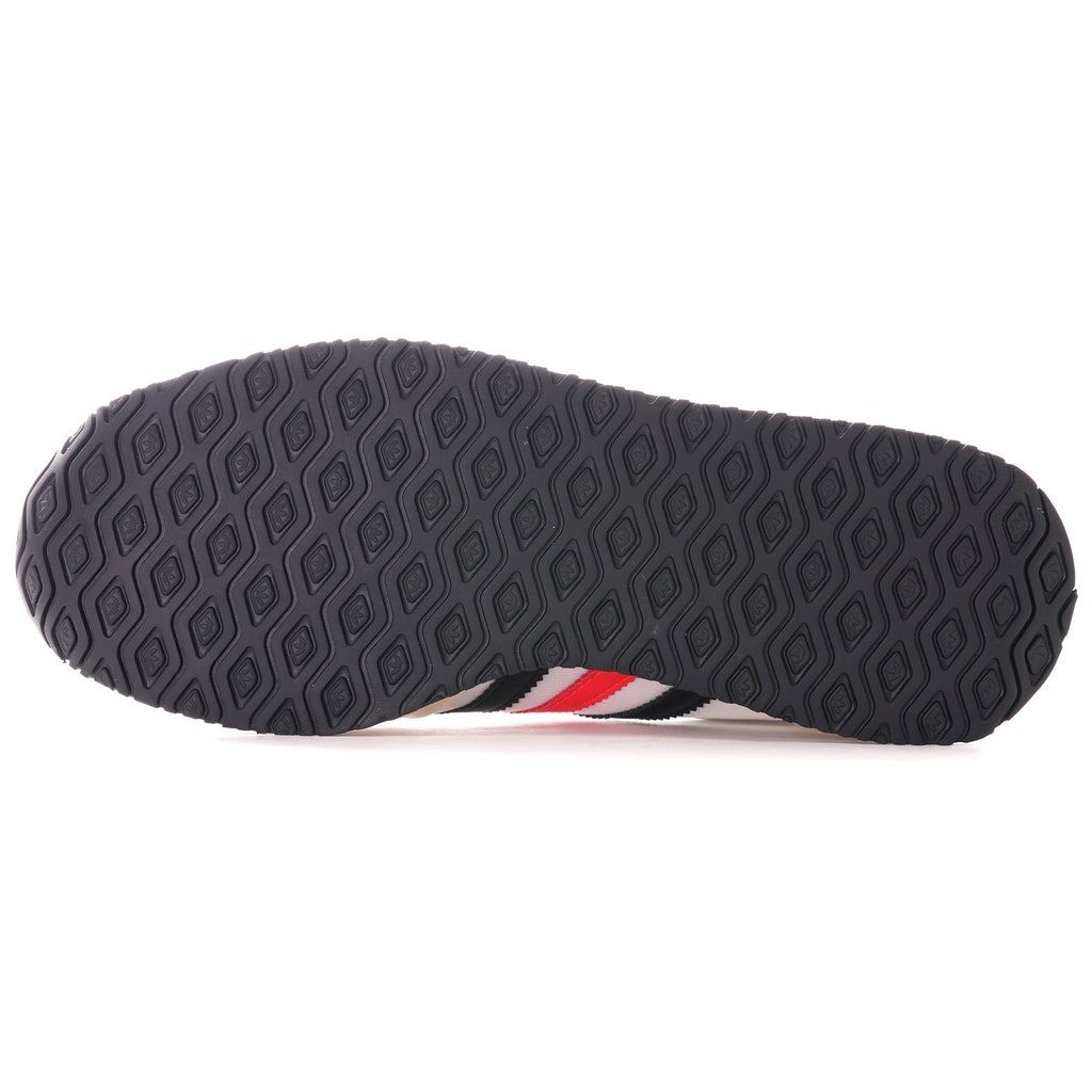 The sole of an Adidas USA 84 trainer with a honeycomb grip pattern.