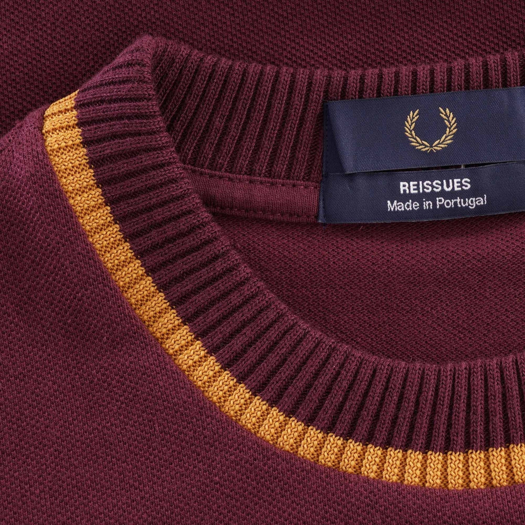 Close-up of the Fred Perry Reissues crew neck t-shirt collar and label.