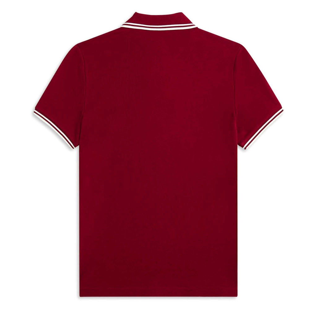 The back of a Fred Perry polo shirt in a rich, dark red with white twin-tipping.