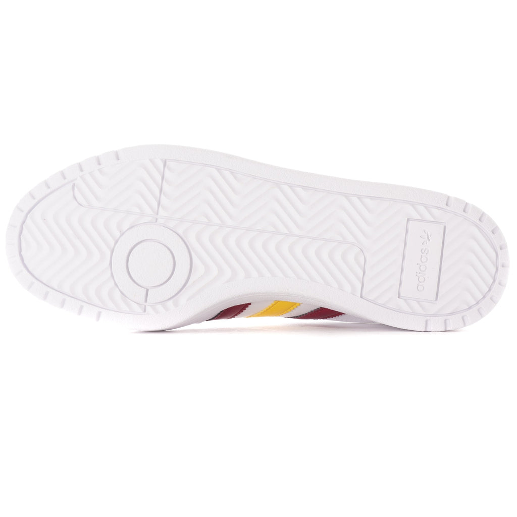 The white sole of an Adidas trainer, showing textured grip patterns.