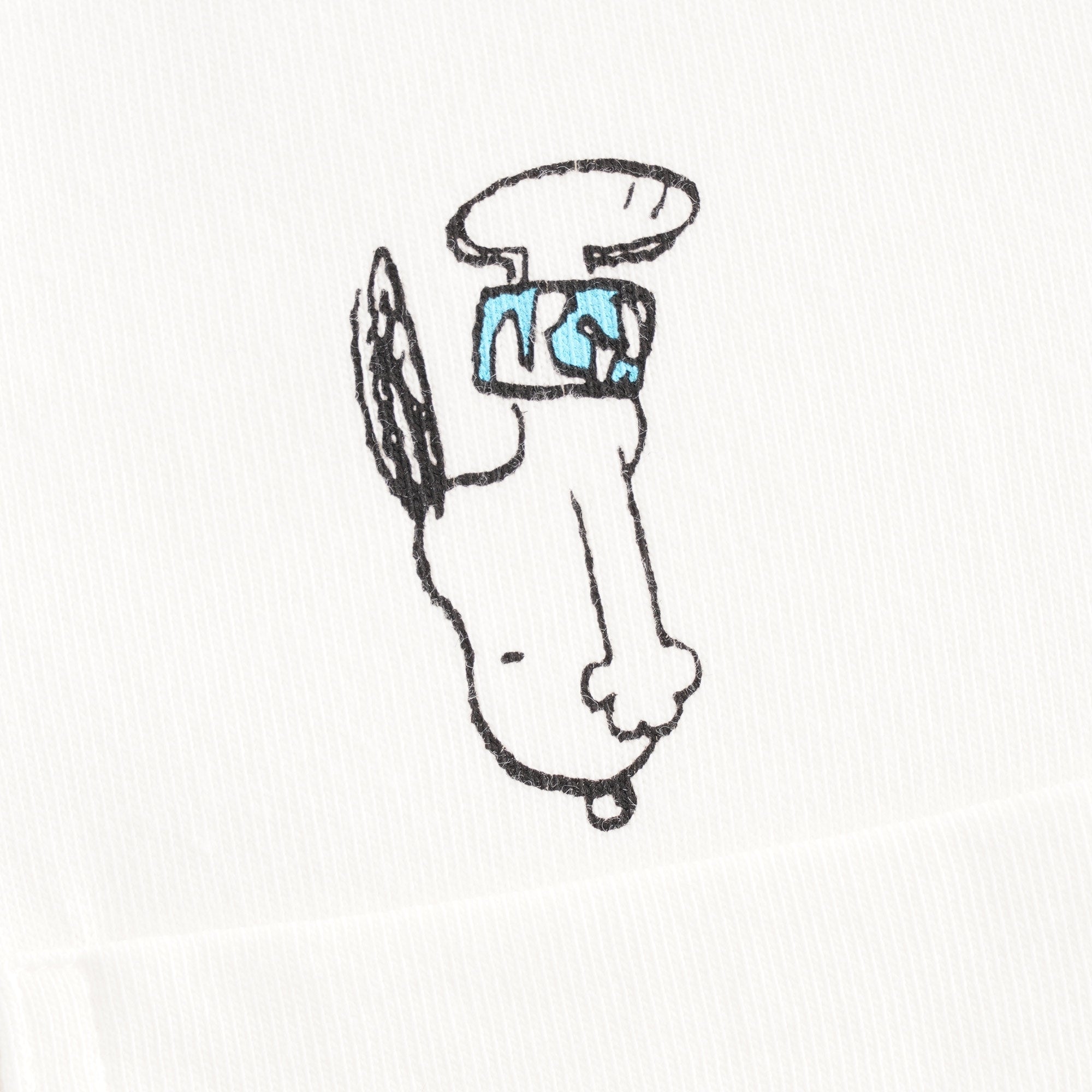 A close-up of Snoopy playing tennis with a tennis racket on a white t-shirt.