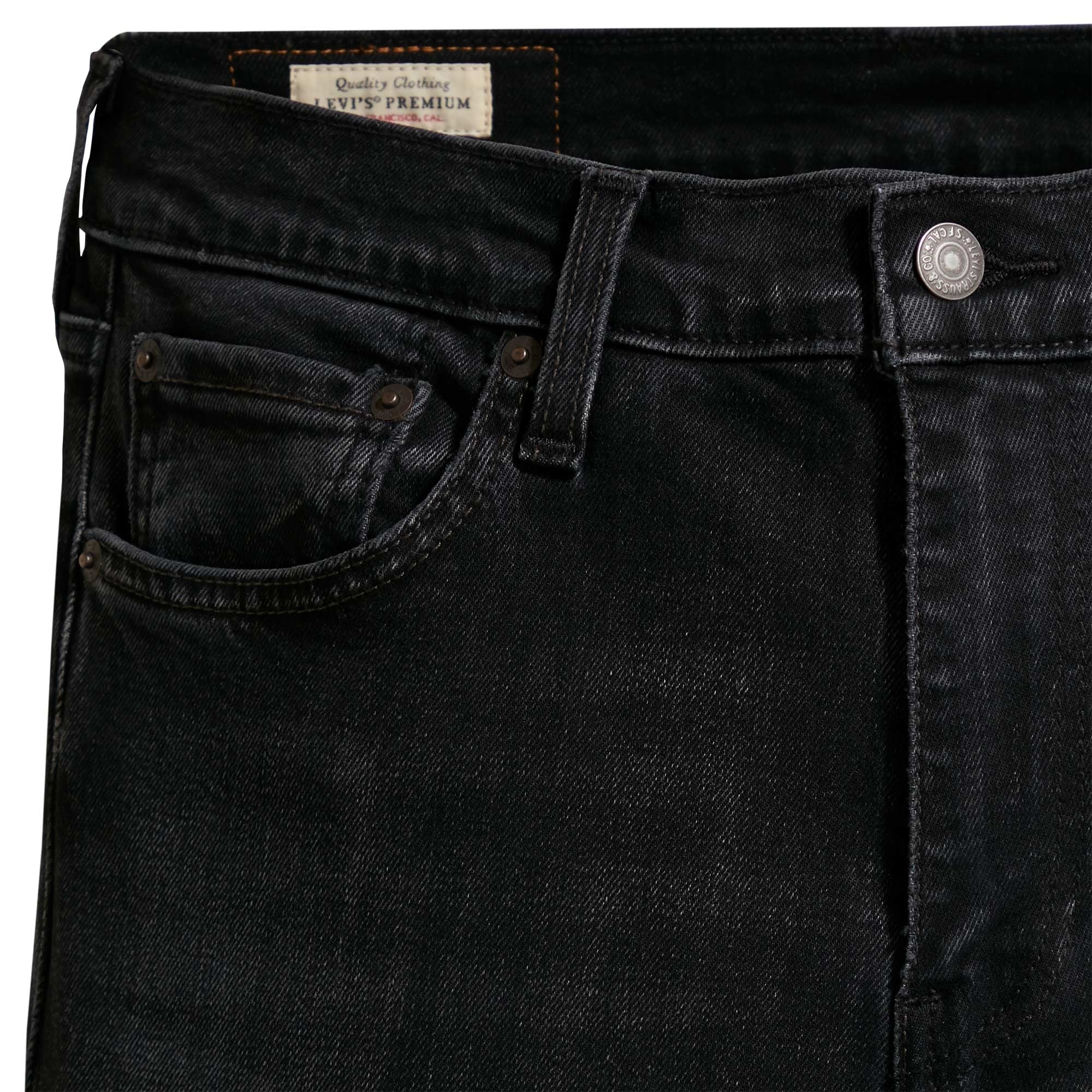 Detailed view of the front pocket area on Levi's 519 men's black jeans.