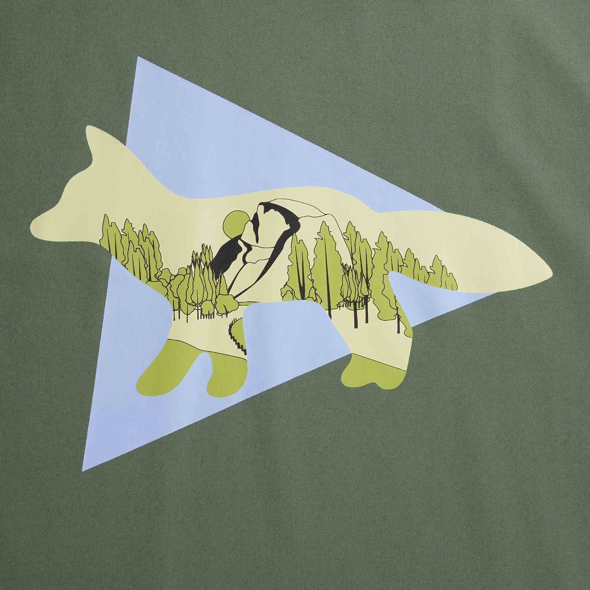 Detailed close-up of the fox graphic on the olive green t-shirt.